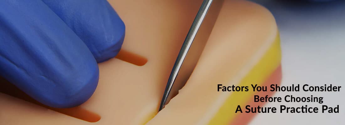 a man holding scalpel and practicing on suture pad